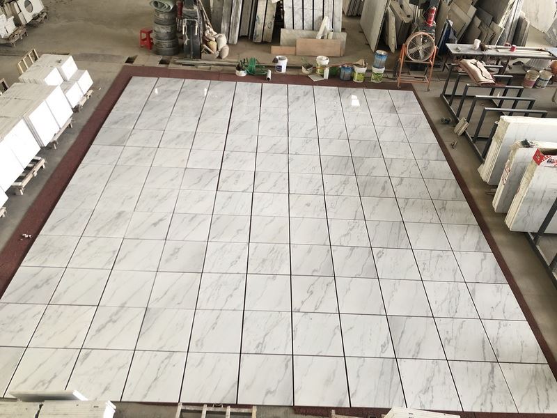 China Carrara White Marble tiles dry lay.jpg China Carrara White Marble tiles dry lay.jpg